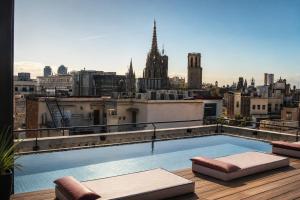 a swimming pool on the roof of a building at Kimpton Vividora Hotel by IHG in Barcelona