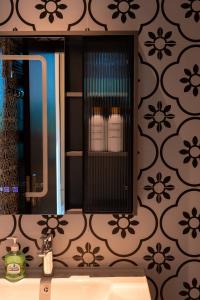 a bathroom with a sink and a mirror at DoDo Apartments in Hanoi +102 photos