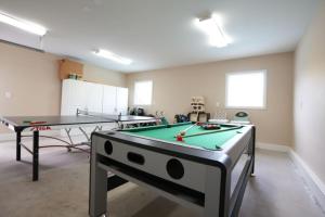 a room with two ping pong tables in it at Sweet 5 Bedroom, 4 Bath Pool Home 1/2 Mile Walk To Disney in Anaheim