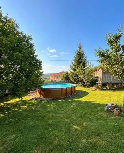 a swimming pool in the middle of a yard at A Casa do Ferreiro in Cerdedo