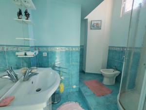 a bathroom with a sink and a toilet at Villa du Capelan - BANDOL in Bandol +8 photos