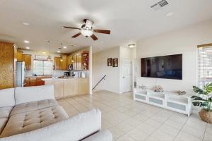 a large living room with a couch and a tv at Scenic Riverfront Home with Boat Access, Private Pool/Hot Tub - Close to Shopping in Lago Vista