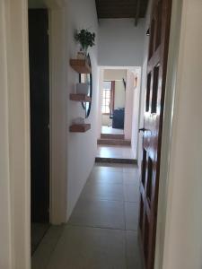 a hallway with white walls and a hallway with at BAHIA BLANCA-BARRIO PARQUE in Bahía Blanca