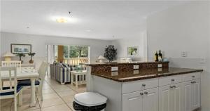 a kitchen with a counter top and a dining room at Nature Lovers Paradise in Inverness