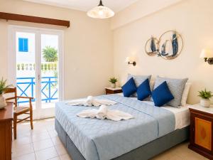 Vuode tai vuoteita majoituspaikassa Karidis Hotel
