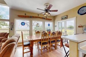 a kitchen and dining room with a table and chairs at Waterfront Home with Kayak, View, Fire Pit & WiFi - Dog-Friendly in Buchanan Dam