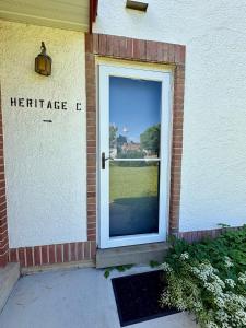 a door to a residence with a view of a yard at The Nelson Inn in Sheridan