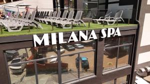 a reflection of a yacht in a window at Milana SPA & Hotel - SPA included in Bukovel