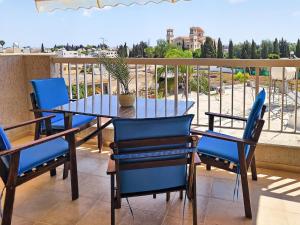 a table and chairs on a balcony with a view at Rest Studio 6 in Sotira