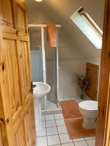 a bathroom with a sink and a toilet at The Cliffs of Moher House, Doolin in Doolin +71 photos