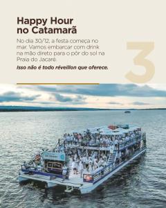 a group of people on a boat in the water at Laguna Praia Hotel in João Pessoa