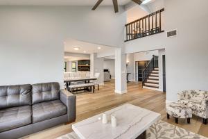 a living room with a couch and a table at Pet Friendly! Canal-Front Apollo Beach Gem w/ Pool in Apollo Beach
