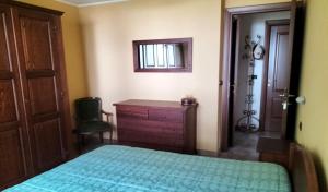a bedroom with a bed and a dresser and a window at La Betulla in Oyace +14 photos