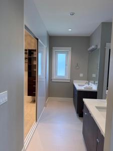 a bathroom with a shower and a sink and a mirror at Mariposa Cozy Stay in Richmond +54 photos