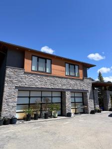 a large building with windows and potted plants at Mariposa Cozy Stay in Richmond
