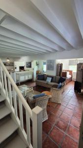 a living room with a couch and a table at The Ark Holiday Home in Stanford +40 photos