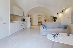 a living room with a couch and a table at Palazzo Galluccio in Galatina