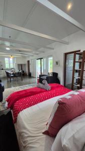 a bedroom with a large bed with a stuffed animal on it at 40 on Longmarket in Stanford