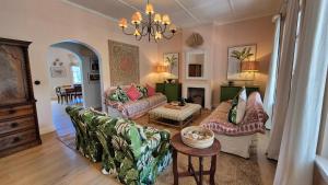 a living room with two couches and a table at Stanford Villa in Stanford +60 photos