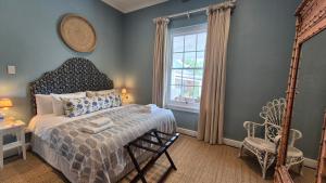 a bedroom with a bed and a window at Stanford Villa in Stanford