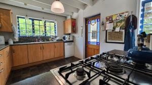 a kitchen with a stove top oven in a kitchen at Lavender’s Blue in Stanford +35 photos