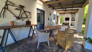 a patio with a wooden table and chairs at Lavender’s Blue in Stanford
