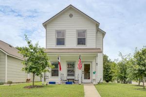 a white house with two american flags in the yard at < 1 Mi to Georgetown Square & SU! Extended Base in Georgetown