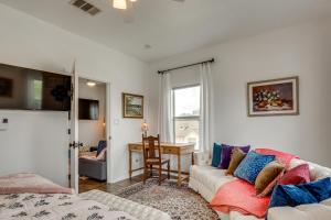 a living room with a couch and a table at < 1 Mi to Georgetown Square & SU! Extended Base in Georgetown