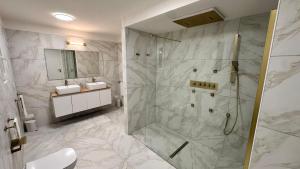 a bathroom with a shower and a sink at Panorama Terrace - Como Lake in Como +48 photos