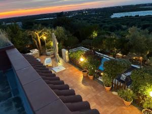 a set of stairs leading to a swimming pool at night at villa lanterna in Conversano