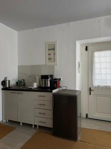 a kitchen with a sink and a counter top at ΑtoZ studio in Hydra in Hydra