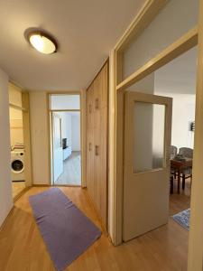 an open door to a room with a purple rug at Apartment Lamele Bugojno in Bugojno