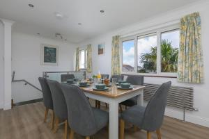 a dining room with a table and chairs at Ocean Parc in Carbis Bay