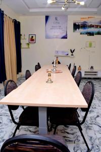a conference room with a large table with chairs at Residence LaFina in Saly Portudal