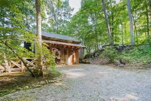 a small cabin in the middle of a forest at Nolichuckey Bluffs Bed & Breakfast Cabins in Greeneville