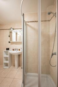 a bathroom with a shower and a sink at La Plage - Studio - Face à la Mer - Clim Terrasse in Menton