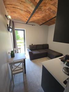 a living room with a couch and a table at Dom w Młodzianowie in Milicz