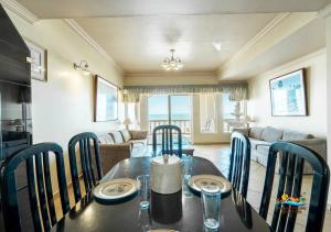 a dining table and chairs in a living room at Jerry in San Felipe