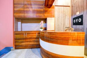a room with a wooden wall at Hotel O New Star Guest House in Behāla
