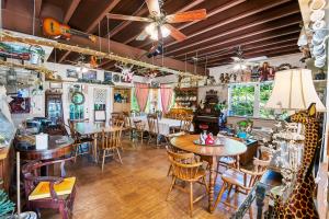 a restaurant with tables and chairs in a room at Nolichuckey Bluffs Bed & Breakfast Cabins in Greeneville +56 photos