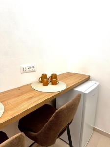 a table with two brown shoes on a plate on it at A casa di Cetta in Melendugno