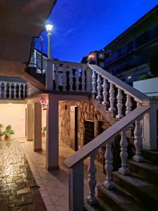 a house with a staircase and a fireplace at Apartman Aurora in Ičići