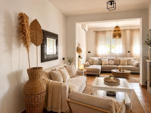 a living room with a couch and a table at Villa Oasys in Almería
