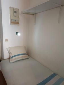 a small bed in a small room at Studio PARAY CENTRE LOGIS 12 in Paray-le-Monial