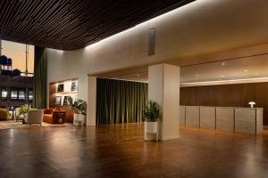 a lobby with a reception desk in a building at ROW NYC at Times Square in New York