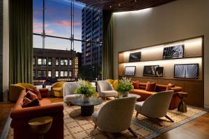 a lobby with couches and chairs in a building at ROW NYC at Times Square in New York +57 photos