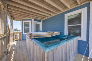 a jacuzzi tub on a blue house at 7048 - Tide Song in Rodanthe