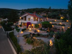 an aerial view of a house with lights at Chariclea Villas Retreat in Samos