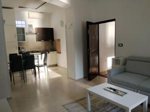 a living room with a couch and a table at Marko in Fažana