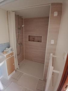 a bathroom with a shower and a sink at La maison d'Arthur et Armelène in Rely +18 photos